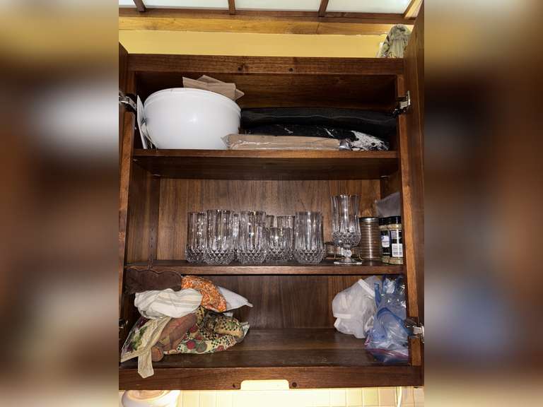 Contents of cabinet, (glassware, oven mitts, etc)
