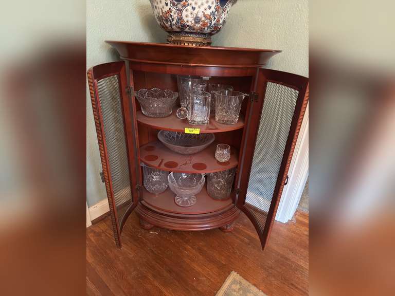Standing bar with crystal glassware contents with large serving top built in