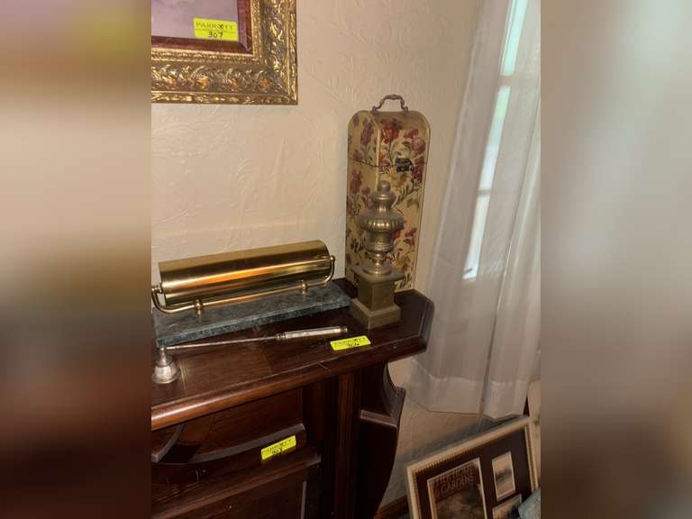 Accent light on marble base, fireplace matches, brass decorative piece, light extinguisher