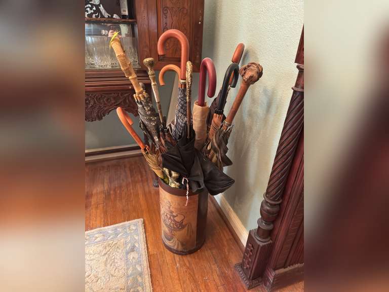 10+/- umbrellas in stand