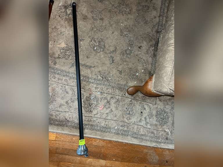 Knife in handle spring loaded walking cane with wolf design and etchings (wolf piece needs reattache