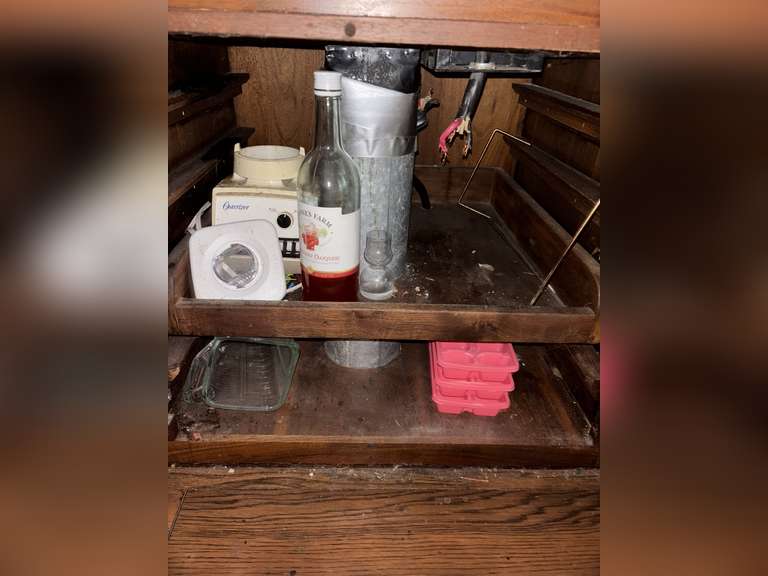 Contents of cabinet under stovetop