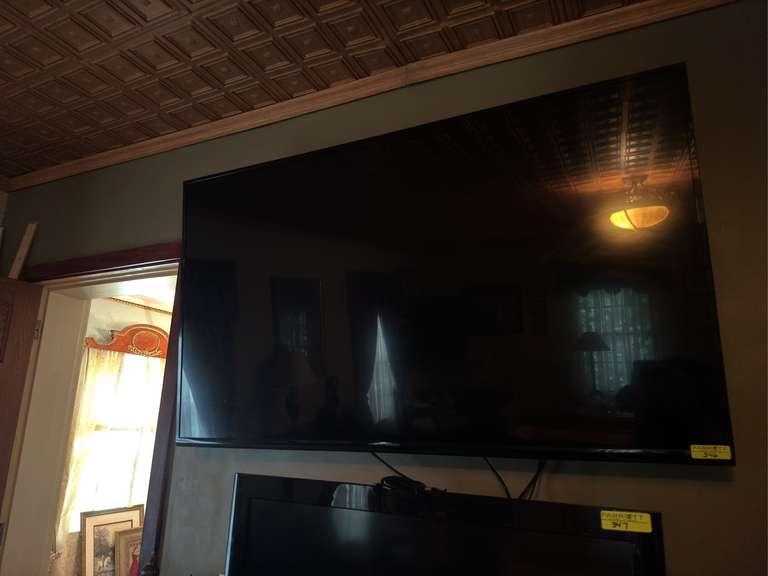 70 inch SHARP tv mounted in living room
