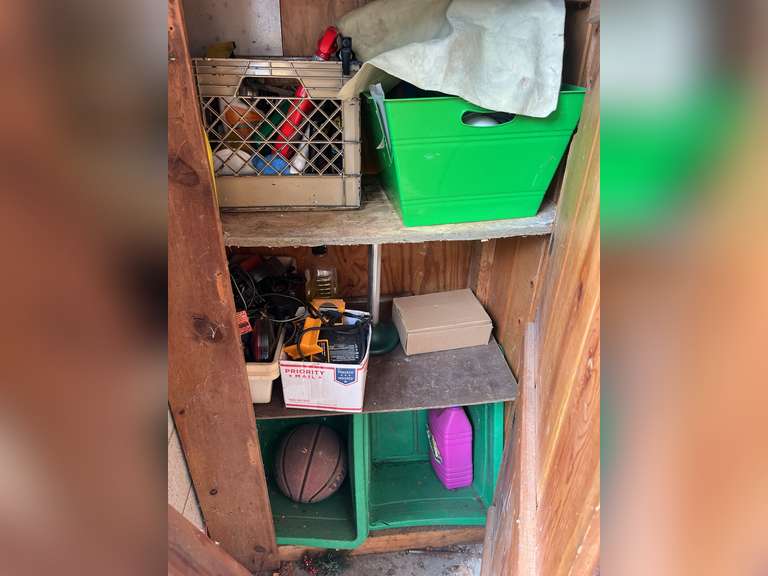 Contents of lower cabinet (spray bottles, chisel sharpeners, etc)