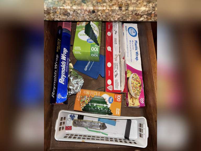 Contents of drawers and cabinets under sink (cleaning supplies and zip lock bags, etc)