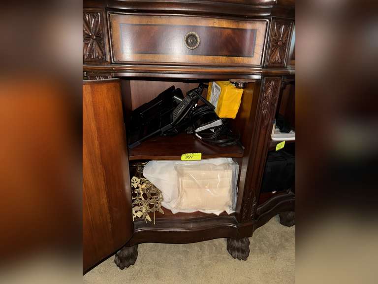 Wall mount tv mount with other items under middle door of buffet table