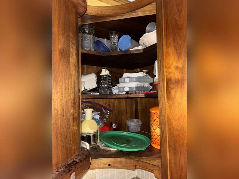 Contents of cabinet ( ice packs, pineapple cookie jar, glassware & more)