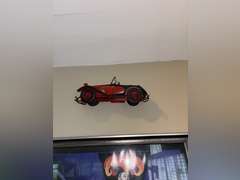 Various framed pictures w/decorative items on north-east wall