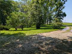 Home with Walk-Out Basement & Outbuildings on 5+/- Acres