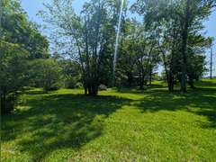 Home with Walk-Out Basement & Outbuildings on 5+/- Acres
