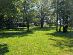 Home with Walk-Out Basement & Outbuildings on 5+/- Acres