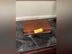 Contents of Table (wooden case with card set, Marvin the Martian stone figure, BMW Neon Sign, and Mo