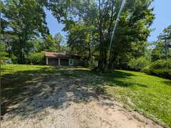Home with Walk-Out Basement & Outbuildings on 5+/- Acres