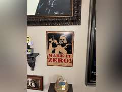 Various framed pictures w/decorative items on north-east wall