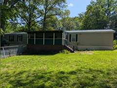Home with Walk-Out Basement & Outbuildings on 5+/- Acres