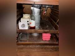 Contents of cabinet under stovetop