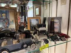 Shelf of model cars and other decorations