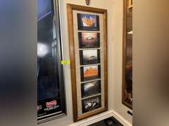 Various framed pictures w/decorative items on north-east wall
