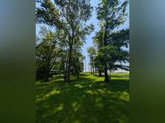 Home with Walk-Out Basement & Outbuildings on 5+/- Acres
