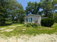 Home with Walk-Out Basement & Outbuildings on 5+/- Acres