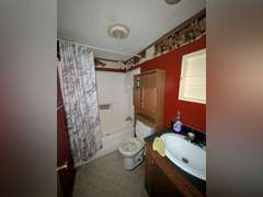 Home with Walk-Out Basement & Outbuildings on 5+/- Acres