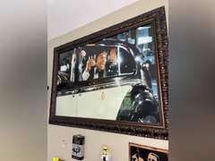 Various framed pictures w/decorative items on north-east wall