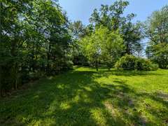Home with Walk-Out Basement & Outbuildings on 5+/- Acres