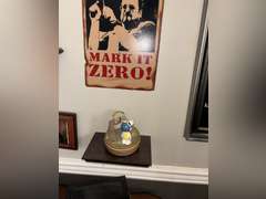 Various framed pictures w/decorative items on north-east wall