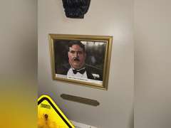 Various framed pictures w/decorative items on north-east wall