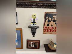 Various framed pictures w/decorative items on north-east wall