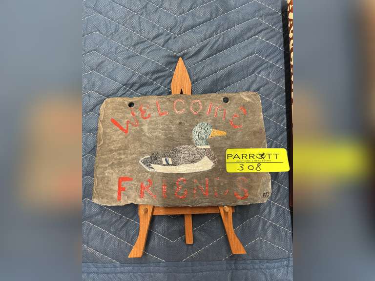 Welcome stone sign with 2 pocket knives