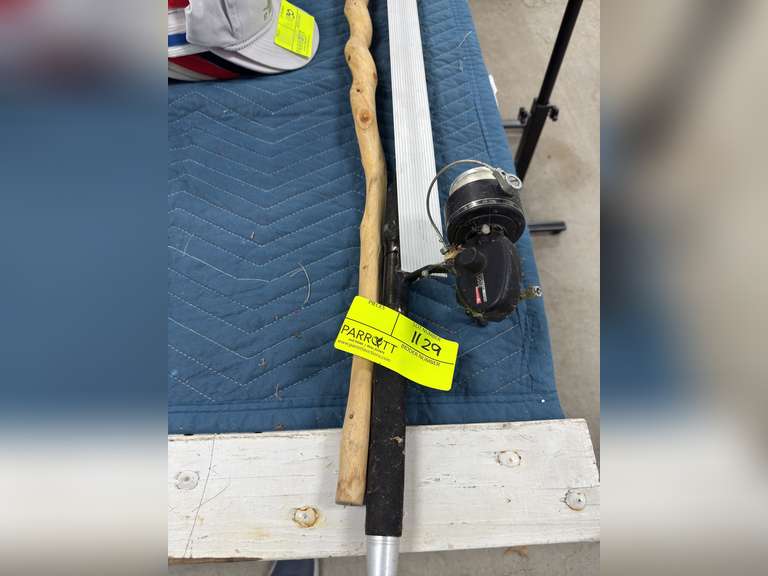 Carved wood waking stick with t-square and fishing rod