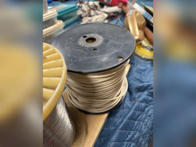 Vice grips, spool of cables and wires, and more