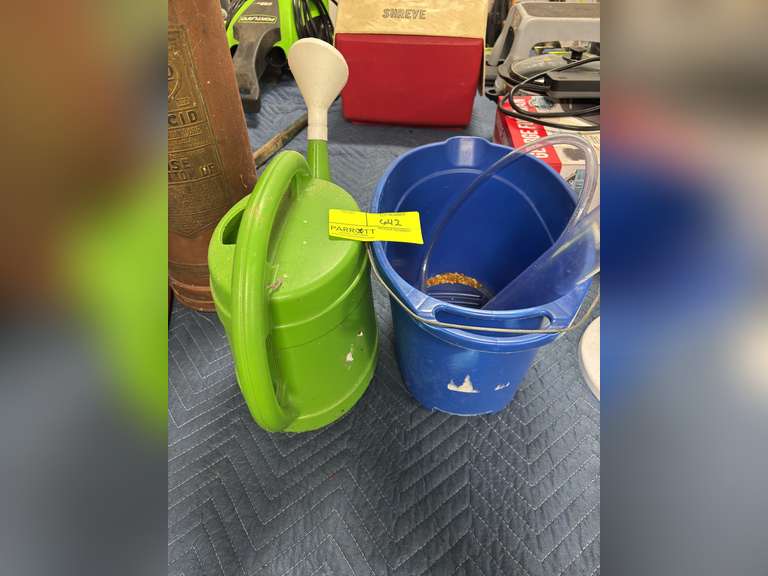 Green watering can, & blue mop bucket