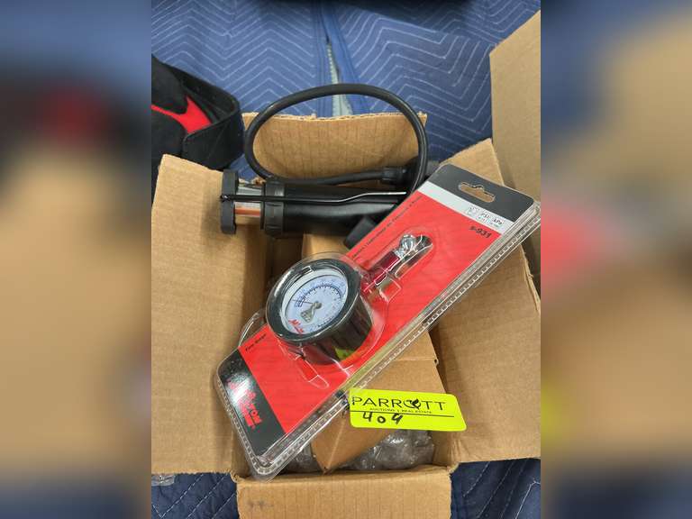 Air compressing pump with tire gage