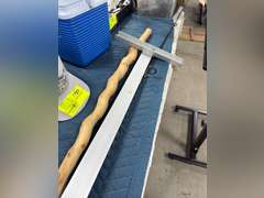 Carved wood waking stick with t-square and fishing rod