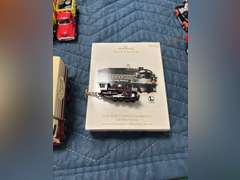 Brand name box trucks, school buses, and Hallmark New York Central Locomotive Christmas ornament