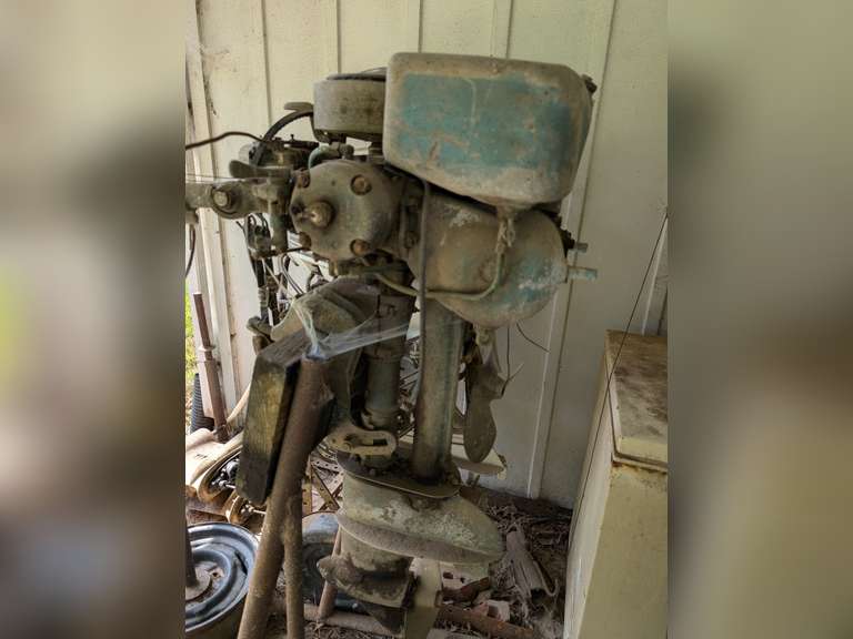 Vintage Outboard Motor on Stand, Has Been Sitting Under Carport