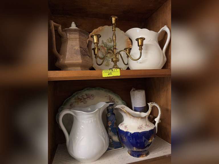 Brass candle stick, 2 iron stone pitchers, platter, other decorative pitcher, and more