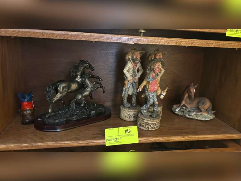 Shelf of Hilbilly figures, horse statues, and cowboy boot home decor