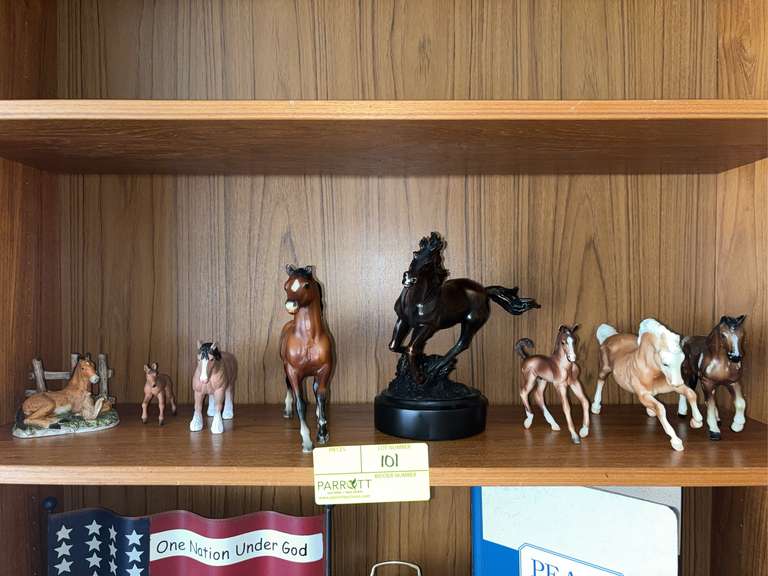 Shelf of horse figurines