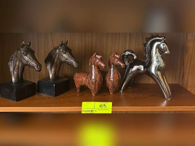 Shelf of Horse head busts and other horse statues