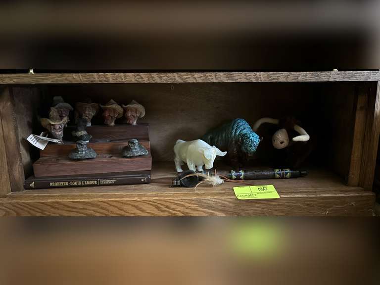Buffalo and bull figures, native American pipe, stuffed bull toy, hillibily, & photograph book