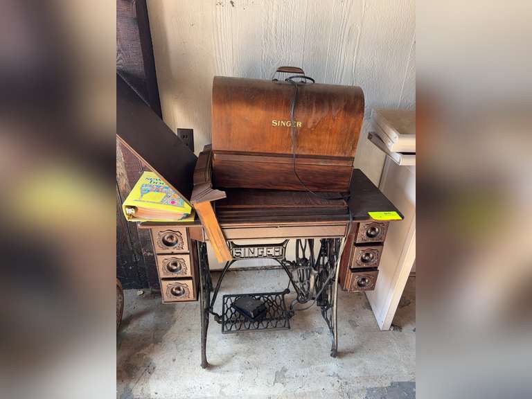 Singer treadle sewing machine cabinet with electric sewing machine