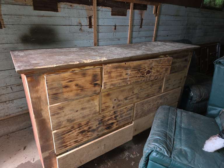 Old couches, wooden dresser, & toilet