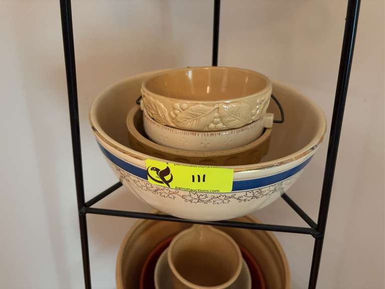 Top two shelves of pottery