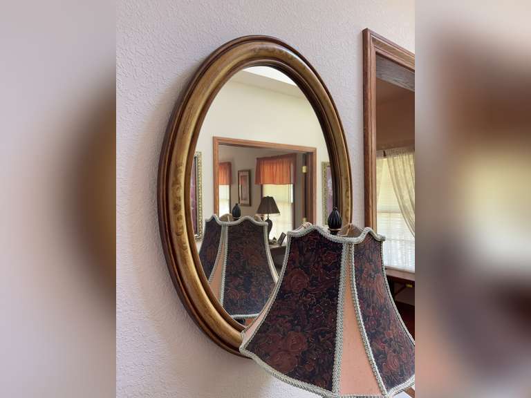 Oval wall mirror with hand painted decoration