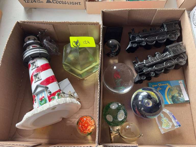 Glass train cars, porcelain light house, and paper weights