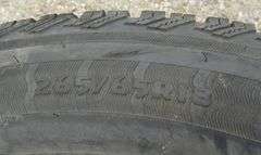 E-129  Chevy Tires + Wheels (4)
