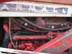 E-1267 McCormick Farmall 806 Tractor W/ Backhoe Attachment